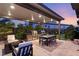 Luxury outdoor kitchen, fire pit, and dining area at 5167 Rock Daisy Dr, Las Vegas, NV 89135