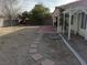 Backyard with potential for customization, patio cover, and block fence at 5624 Silver Belle St, Las Vegas, NV 89149