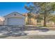 Charming single-story home featuring a well-maintained front yard, a two-car garage, and a beautiful terracotta roof at 5624 Silver Belle St, Las Vegas, NV 89149