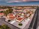 Aerial view showing house, pool, detached garage, and gated entry at 5750 Edna Ave, Las Vegas, NV 89146