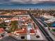 Aerial view of the house, neighborhood, and city skyline at 5750 Edna Ave, Las Vegas, NV 89146