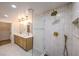 Modern bathroom with double vanity, large shower, and updated fixtures at 5750 Edna Ave, Las Vegas, NV 89146