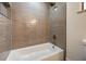 Clean bathroom with bathtub and updated shower with modern tile at 5750 Edna Ave, Las Vegas, NV 89146