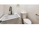 Clean bathroom with white sink, toilet, and modern fixtures at 5750 Edna Ave, Las Vegas, NV 89146