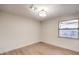 Simple bedroom with light wood floors and a window at 5750 Edna Ave, Las Vegas, NV 89146