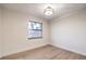 Well-lit bedroom with light wood floors and a window at 5750 Edna Ave, Las Vegas, NV 89146