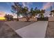 Landscaped front yard with a long driveway at 5750 Edna Ave, Las Vegas, NV 89146