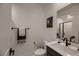 Modern bathroom featuring a sleek vanity, decorative towel rack, and a glass-enclosed shower at 6289 Redstone Hills Dr, Las Vegas, NV 89148