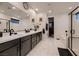 Spacious bathroom featuring double vanities, glass shower and elegant marble flooring at 6289 Redstone Hills Dr, Las Vegas, NV 89148