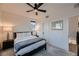 Cozy bedroom with neutral tones, plush carpet, and stylish ceiling fan at 6289 Redstone Hills Dr, Las Vegas, NV 89148