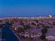 Expansive cityscape view from a residential area, capturing the vibrant city lights and skyline at 6289 Redstone Hills Dr, Las Vegas, NV 89148