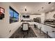 Bright dining area features stylish pendant lighting, modern furniture, and an adjacent gourmet kitchen at 6289 Redstone Hills Dr, Las Vegas, NV 89148
