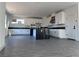 Modern kitchen with large island, black countertops, and ample cabinet space at 6289 Redstone Hills Dr, Las Vegas, NV 89148