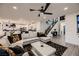 Open-concept living room leads to kitchen and staircase, perfect for entertaining at 6289 Redstone Hills Dr, Las Vegas, NV 89148