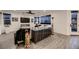 Modern living room with a sleek media console and hardwood floors at 6289 Redstone Hills Dr, Las Vegas, NV 89148