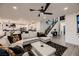 Open concept living area with stylish decor, modern furnishings, and seamless flow to the kitchen at 6289 Redstone Hills Dr, Las Vegas, NV 89148