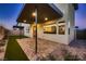 View of the covered patio with brick pavers and landscaping at 6289 Redstone Hills Dr, Las Vegas, NV 89148