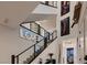 Modern glass and metal staircase with artwork at 6289 Redstone Hills Dr, Las Vegas, NV 89148