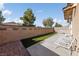 Artificial turf backyard with patio furniture and a block wall at 6333 Supernova Hill St, North Las Vegas, NV 89031