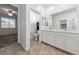 Double vanity bathroom with a toilet and a separate shower at 6333 Supernova Hill St, North Las Vegas, NV 89031