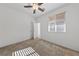 Well-lit bedroom with ceiling fan and carpet flooring at 6333 Supernova Hill St, North Las Vegas, NV 89031