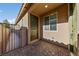 Front entry with a green door and paved walkway at 6333 Supernova Hill St, North Las Vegas, NV 89031