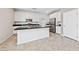 Modern kitchen with white cabinets, granite counters, and stainless steel appliances at 6333 Supernova Hill St, North Las Vegas, NV 89031