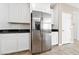 Stainless steel refrigerator with ice maker and white cabinetry at 6333 Supernova Hill St, North Las Vegas, NV 89031