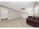 Spacious living room with tile floors and a sofa at 6333 Supernova Hill St, North Las Vegas, NV 89031