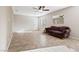 Living room with tile flooring and a comfy sofa at 6333 Supernova Hill St, North Las Vegas, NV 89031