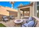 Backyard patio with seating area and artificial turf at 6737 Fast Brook Ct, North Las Vegas, NV 89084