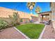 Landscaped backyard with artificial turf and patio at 6737 Fast Brook Ct, North Las Vegas, NV 89084