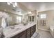 Double vanity bathroom with soaking tub and walk-in shower at 6737 Fast Brook Ct, North Las Vegas, NV 89084