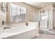 Bathroom features a large soaking tub and a separate shower at 6737 Fast Brook Ct, North Las Vegas, NV 89084