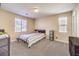 Bright bedroom with double window and carpet flooring at 6737 Fast Brook Ct, North Las Vegas, NV 89084