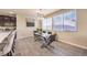 Bright dining area with glass table and modern chairs at 6737 Fast Brook Ct, North Las Vegas, NV 89084