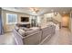 Living room with sectional sofa, view of kitchen and stairs at 6737 Fast Brook Ct, North Las Vegas, NV 89084