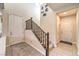 Interior view of a staircase with dark wood railing and neutral wall colors at 6737 Fast Brook Ct, North Las Vegas, NV 89084