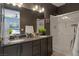 Modern bathroom with dual sinks, a walk-in shower, and a sleek design at 7017 Solana Ridge Dr, North Las Vegas, NV 89084