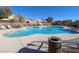 Relaxing community pool with surrounding lounge chairs at 7017 Solana Ridge Dr, North Las Vegas, NV 89084