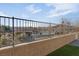 View of community pool through a fence at 7017 Solana Ridge Dr, North Las Vegas, NV 89084