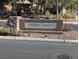 Tierra Santa community sign with stone base, surrounded by landscaping at 7017 Solana Ridge Dr, North Las Vegas, NV 89084