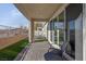 Covered patio with seating area overlooking backyard at 7017 Solana Ridge Dr, North Las Vegas, NV 89084