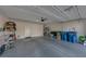 A clean garage with epoxy flooring, storage, and a well-lit interior at 7017 Solana Ridge Dr, North Las Vegas, NV 89084