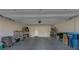 Spacious garage with clean epoxy floors, storage shelves, and ample space at 7017 Solana Ridge Dr, North Las Vegas, NV 89084