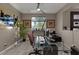 Bright home office with glass desk, comfortable chair and ample natural light at 7017 Solana Ridge Dr, North Las Vegas, NV 89084