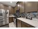 Modern kitchen with stainless steel appliances and island at 7017 Solana Ridge Dr, North Las Vegas, NV 89084