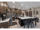 Modern kitchen featuring a quartz island, stainless steel appliances, and stylish bar stool seating at 7017 Solana Ridge Dr, North Las Vegas, NV 89084