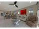 Bright living room with a modern design, tile floors and neutral color palette at 7017 Solana Ridge Dr, North Las Vegas, NV 89084