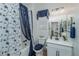 Clean bathroom with tub, shower, and navy blue accents at 724 Last Dance Pl, Henderson, NV 89011